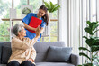 © SKW - Asian women are being cared for by nurses who monitor health and physical therapy for elderly women living alone at home. by walking on a cane or using muscles