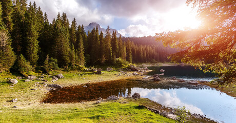 Aufkleber - Amazing nature scenery. Wonderful landscape with forest, calm lake in the mountains. Stunning nature landscape under sunlight