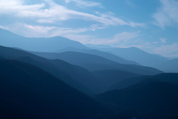 blue gradient layers in nature with sky and mountains. light and dark tones of blue color, abstract 