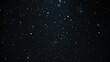 © Kepler - White snow falling on an isolated black background, bokeh of flying snowflakes, dust particles or powder in the air.