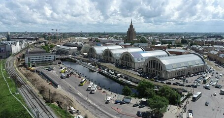 Sticker - Riga Bus Station in Latvia and Market Square in Background. Drone Point of View.