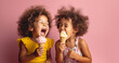 © annebel146 - Two happy dark skinned children eating ice cream Summer, vacation, childhood, motherhood, food concept. Mom treats siblings to ice cream. Kids aged 2 and 3 years eating ice cream