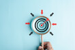 © Kiattisak - Magnifier glass focus to target icon with arrow to planning and management business development leadership and customer target group.