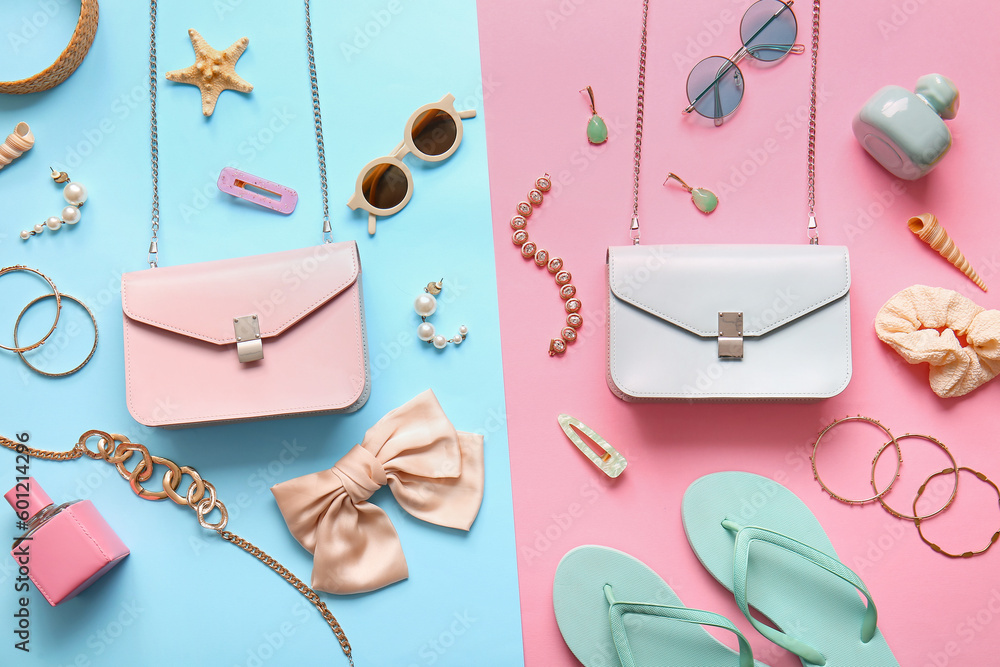 Stylish bags and different accessories on colorful background