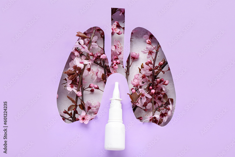 Nasal drops with blooming branches visible through cut lilac paper. Seasonal allergy concept