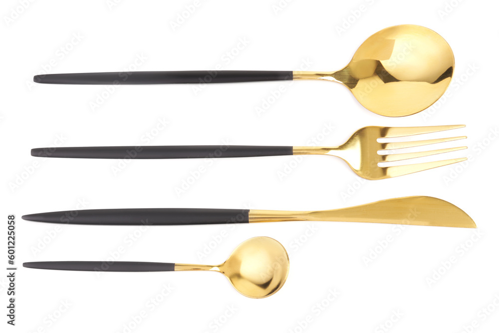 Golden set of cutlery with black handles on white background