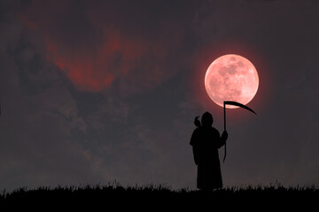 Wall Mural - A silhouette of a Grim Reaper with a crow perched on his shoulder, holding a terrible scythe, looking at the red full moon at night.
