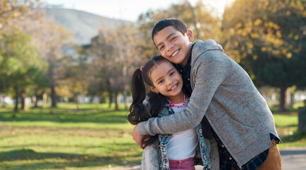 park, hug and portrait of brother and sister enjoying summer day for bonding, quality time and playi