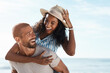 © Chanelle Malambo/peopleimages.com - Love, beach and piggy back, happy couple with blue sky on romantic summer holiday travel to ocean. Romance, man and woman have fun at sea, happiness on honeymoon and vacation time together in Mexico.
