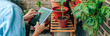 Unrecognizable woman using gardening app with artificial intelligence to care plants of her urban garden on terrace