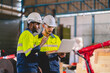 © chokniti - professional technician engineer with safety helmet hard hat working in industrial manufacturing factory, men at work to checking equipment of machinery production technology or construction operating