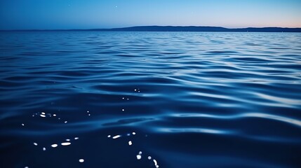beautiful night sea with ripple and light reflections. calm seascape wallpaper background. outdoor b