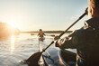 © Grady Reese/peopleimages.com - Kayak, lake and people rowing a boat on the water during summer for recreation or leisure at sunset. Nature, view and horizon with people canoeing for adventure, freedom or travel while on vacation