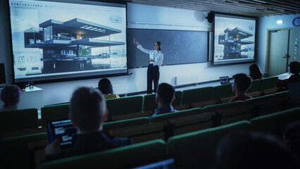 Fototapete - Young University Professor Explaining an Interior Design Styles Lecture to a Group of Diverse Multiethnic Students in a Dark Auditorium. Female Teacher Showing a Housing Project on Two Big Screens