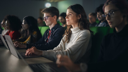Leinwandbilder - Beautiful Smart Female Student Studying in University with Diverse Multiethnic Classmates. She is Using a Laptop Computer. Applying Her Knowledge to Acquire Academic Skills in Class