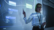 Portrait of a Young Female Professor Explaining Big Data and Artificial Intelligence Research Project in a Dark Room with a Screen Showing a Neural Network Model. Computer Science Education in College