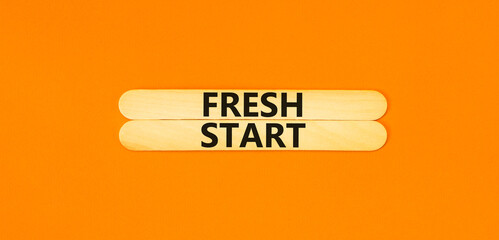 Wall Mural - Fresh start and motivational symbol. Concept words Fresh start on beautiful wooden stick. Beautiful orange table orange background. Business motivational and Fresh start concept. Copy space.