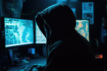 View From Behind Of A Man In A Hood Sitting In Front Of A Computer, The Concept Of A Hacker Trying To Break Into Someone's Computer Generative AI, AI.