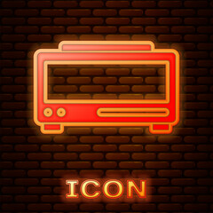 Poster - Glowing neon Digital alarm clock icon isolated on brick wall background. Electronic watch alarm clock. Time icon. Vector