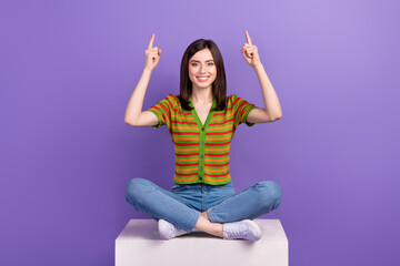 Wall Mural - photo of shiny excited lady wear striped cardigan pointing two fingers up empty space isolated purpl