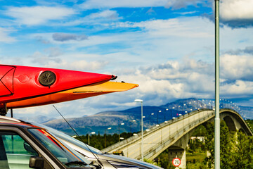 Sticker - Car with canoes on top roof in mountains