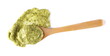 Green mojo sauce, mojo verde, spilled in wooden spoon isolated on white, clipping path 