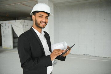 Portrait of a Indian engineer posing at the camera