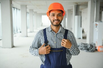 Wall Mural - Portrait of a Indian engineer posing at the camera