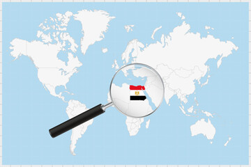 Wall Mural - Magnifying glass showing a map of Egypt on a world map.