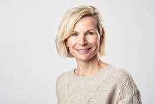 Environmental Portrait Photography Of A Pleased Woman In Her 40s Wearing A Cozy Sweater Against A White Background. Generative AI