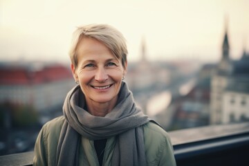 Wall Mural - Environmental portrait photography of a pleased woman in her 50s wearing a charming scarf against an aerial view background. Generative AI