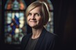 © Leon Waltz - Portrait of a smiling senior woman looking at camera in church.