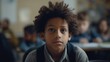 © Rudsaphon - Portrait of a little boy looking at camera in classroom.Generative Ai