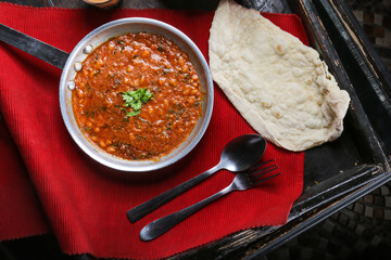 Lobiya masala, loba red beans with bread served in dish isolated on red mat top view on table arabic food