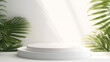 Smooth round white podium in sunlight, tropical palm leaf shadow for on white table countertop, wall for nature luxury hygiene organic cosmetic, skincare, beauty treatment 
