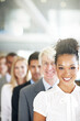 © STEEX/peopleimages.com - Portrait, leadership and a business black woman manager at the from of a queue in her corporate office. Smile, management and a happy female leader standing in line with a team following her vision