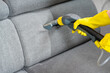 © Ilja - Sofa before and after wet - cleaning indoors. textile sofa vacuum cleaning. professional cleaning service concept.