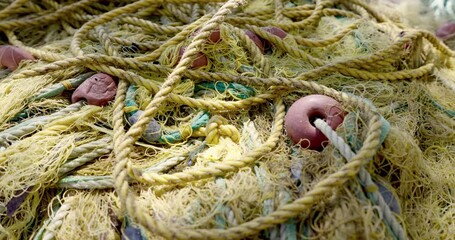 Yellow fishing net with floats. Close-up