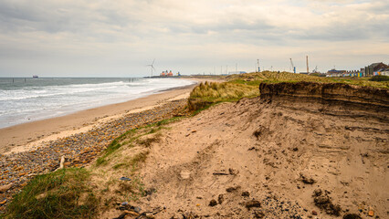 Sticker - Cambois Beach looking south, located between the rivers Blyth and Wansbeck on the Northumberland coast and is a long stretch of sand backed by rocks and grassy dunes