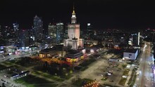 Aerial View Drone Of Warsaw City Center Business District At Night,flying Over Modern Downtown Main Square,skyscrapers Illuminated Streets
