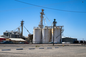 Vintage big concrete silos on a blue sky