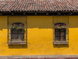 Flowers hanging from windows in Antigua, Guatemala