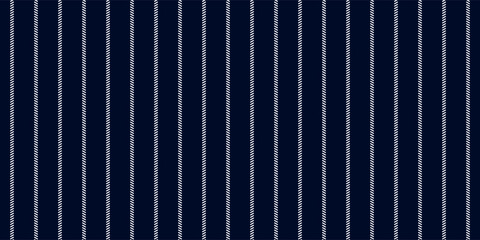 Pinstripe dark blue and white seamless pattern with narrow lines. Classic wool suit fabric. Elegant masculine design. Simple monochrome background. Twill variegated woolen material