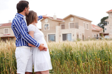 Poster - Young romantic couple standing together in the park