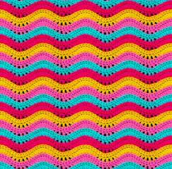 seamless knitted pattern in the form of openwork waves is crocheted with threads of bright colors. a