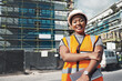 © A. Frank/peopleimages.com - Engineer, construction site and portrait of a black woman outdoor for development and architecture. African female contractor happy about building project, engineering and safety inspection in city
