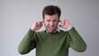 © RealPeopleStudio - The European young man covers his ears. He doesn't want to hear the uncomfortable truth