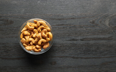 Wall Mural - Cashew nuts in bowl on a wood