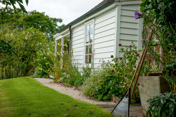 Old English style garden and lawn around cottage