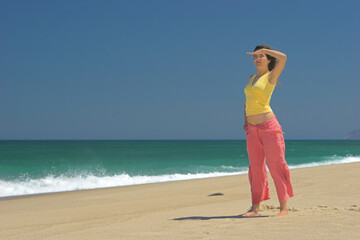 Wall Mural - Beautiful woman in the beach watching